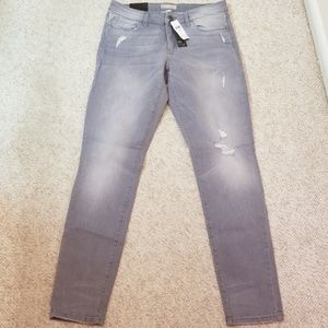 Grey distressed skinny jeans